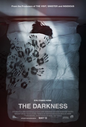 the darkness poster featuring title and a person laying under covers on a bed with only their hair visible. There are handprints all over the covers