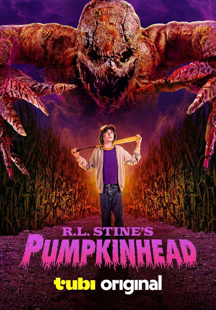 R.L. Stine's Pumpkinhead poster featuring title and kid holding a bat surrounded by corn stalks with a huge scarecrow looming overhead