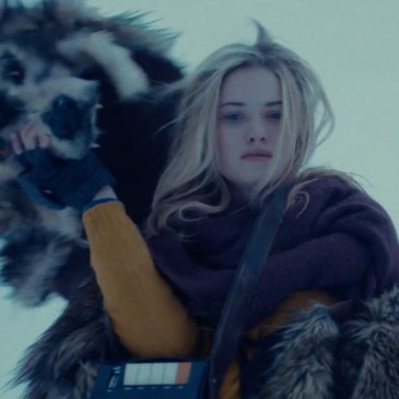 woman holding a tape player removes a faux bear head hood