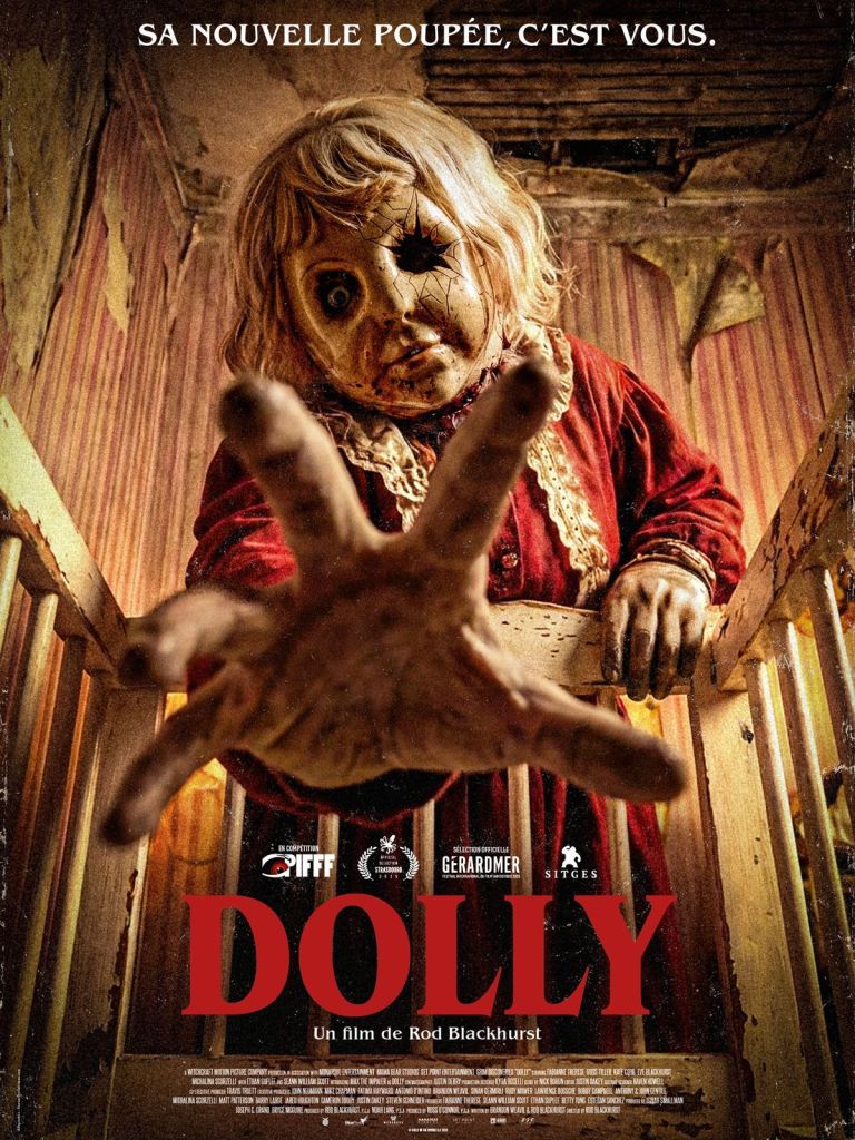 Dolly poster featuring title and large woman in a doll mask reaching toward camera
