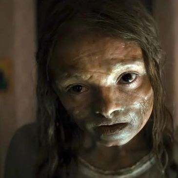 Close up of mummy girl's face with leathery discolored skin