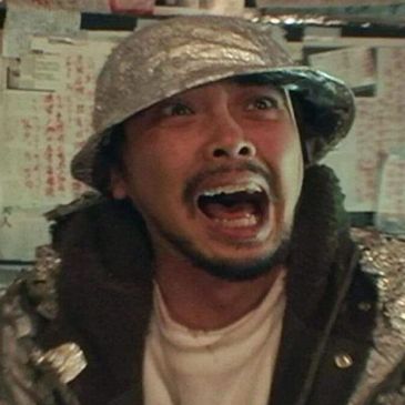A man wearing a tinfoil hat screaming