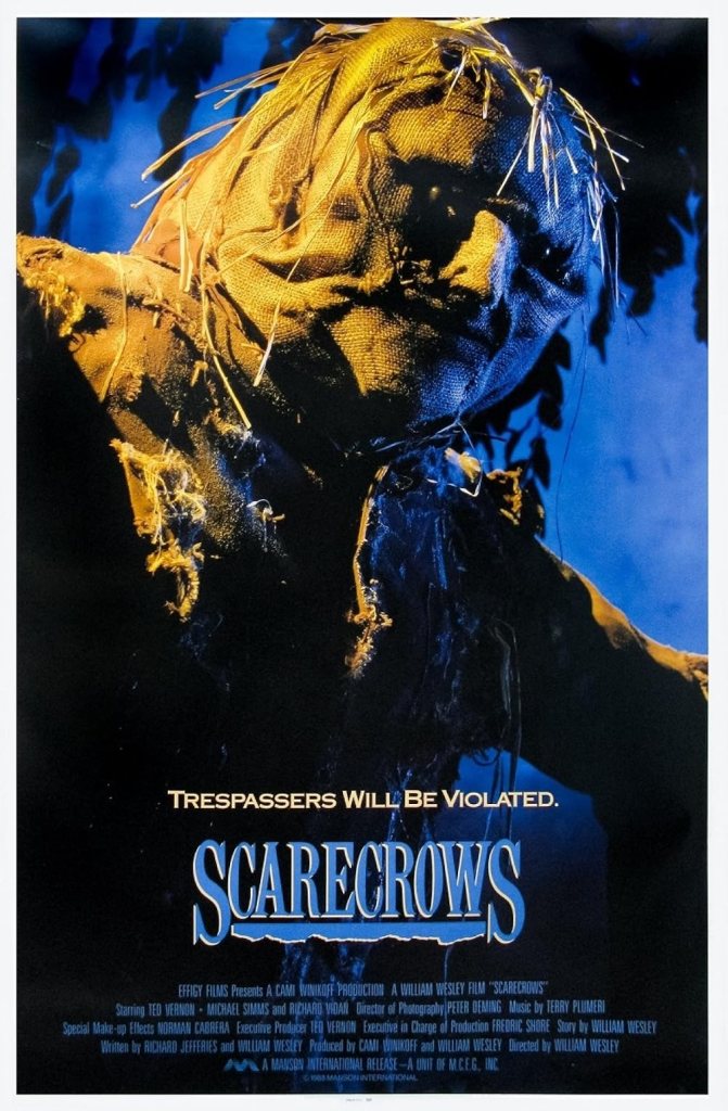 poster featuring title and closeup of scarecrow with burlap sack face and hay for hair